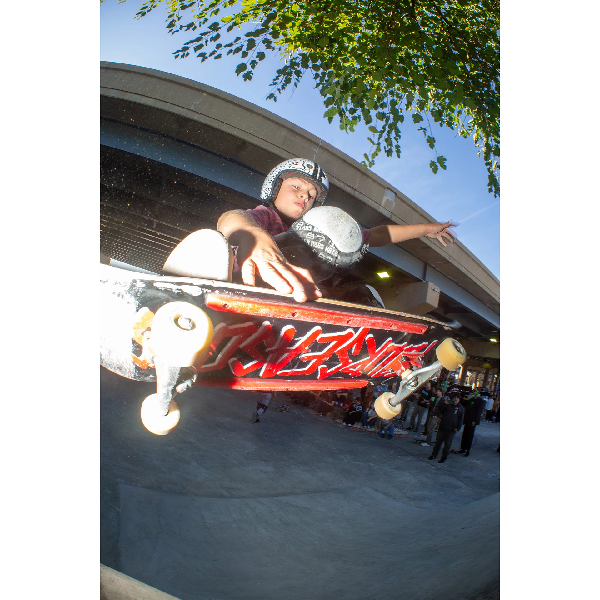 Local skater Bobby Joe in full pads getting big air at National DIY skatepark during a skate jam.  Photo shot by Dylan Shanahan.